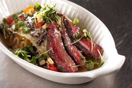 Herb Crusted Bison Ribeye with Wild Mushroom Pasta Stack and Brown Butter Sauce